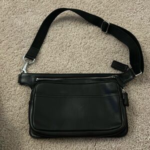 Smooth leather black coach waist pouch.